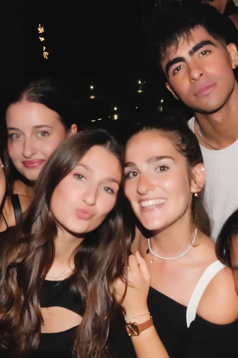 Group of people partying in a nightclub during a Paris pub crawl night tour